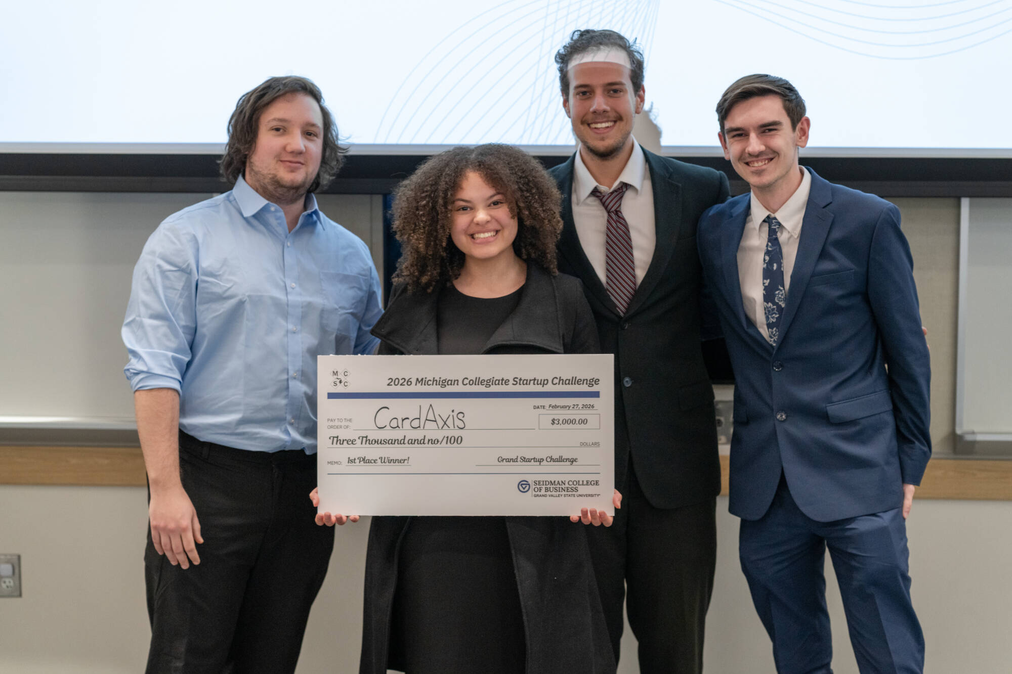 Winning team CardAxis with their prize check